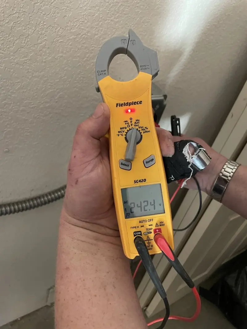 Voltage testing with clamp meter during Electrical Installation Services in West Dundee